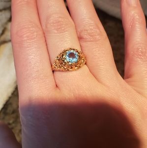 14K gold swiss blue topaz ring.